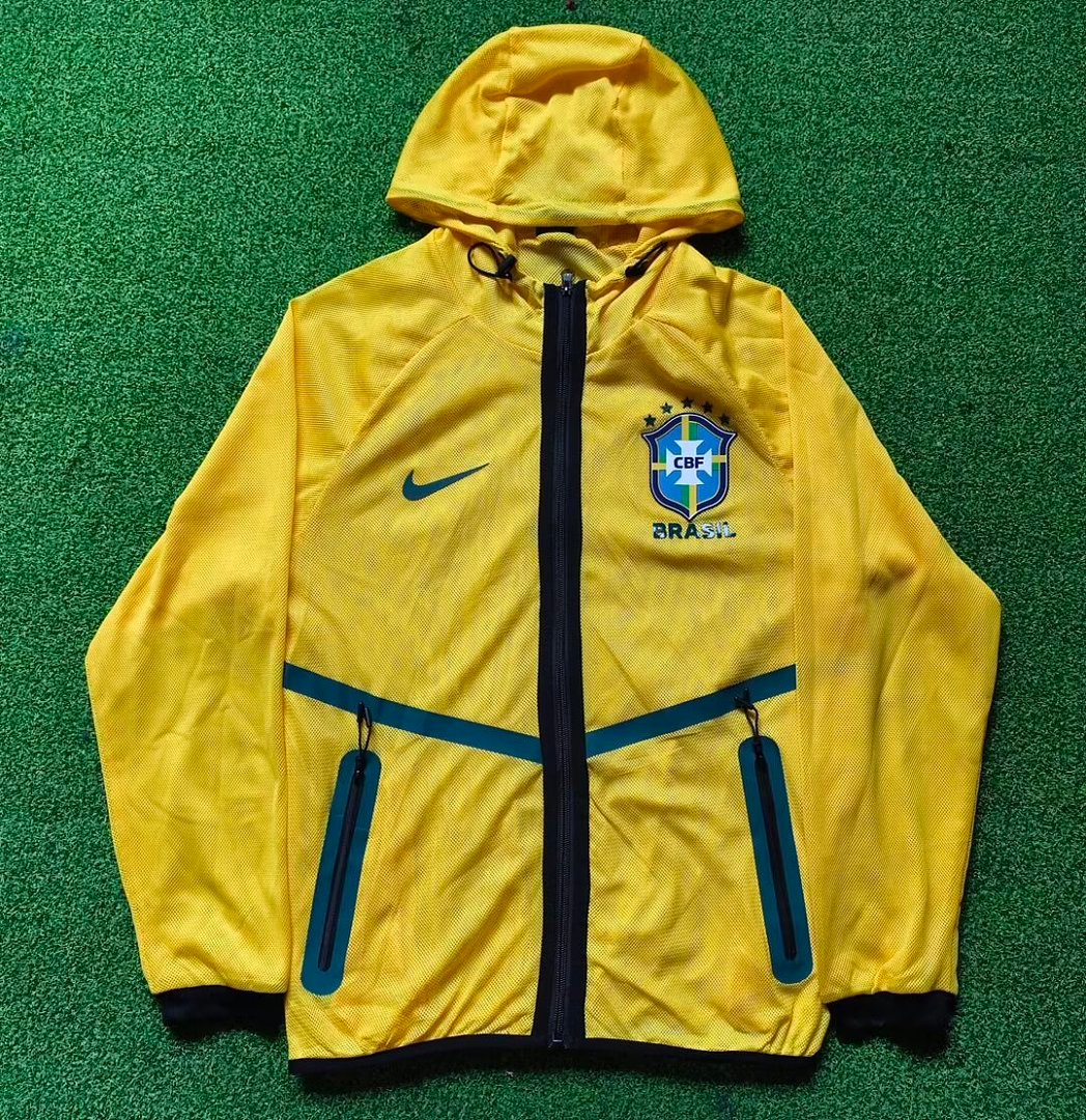 5efb7691 - 副本 2026 Brazil Yellow Windbreaker Soccer Jacket With Hat - Image 1