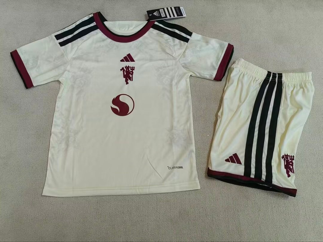 529a2a10 2026-2027 Manchester United Third Away Apricot kids/youth Soccer uniform - Image 1